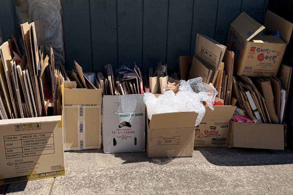 A pile of broken-down cardboard boxes left over after a move